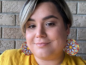 Brianne Cavan-Heard, of Cavan's Creations, models some beaded ear rings that she created. Cavan-Heard was recently accepted into the TikTok Accelerator for Indigenous Creators program offered through the National Screen Institute. SUBMITTED