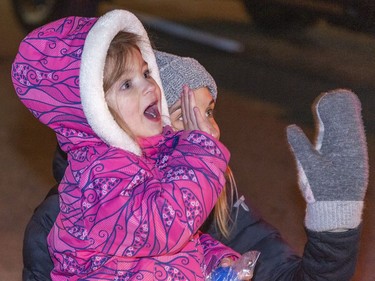 Annie Vinnai, age 3 of Wyndham Centre and her mother Emily wave to Santa on Saturday November 26, 2022 during the city's Santa Claus parade in downtown Brantford, Ontario. Brian Thompson/Brantford Expositor/Postmedia Network