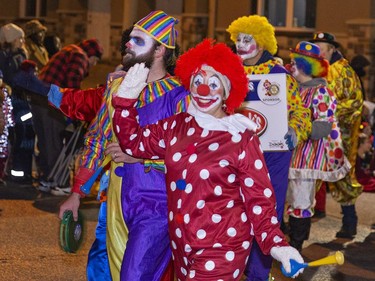 A colourful group of Rotary Clowns for Kids were part of the city's Santa Claus parade in downtown Brantford, Ontario on Saturday evening. Brian Thompson/Brantford Expositor/Postmedia Network