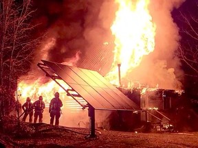 Rideau Lakes firefighters battle a massive structure fire on Mountain Road, north of Westport, early Wednesday morning. (OPP EAST REGION TWITTER)
