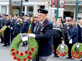Ralph McMullen, president of Royal Canadian Legion Branch 96, prepares to lay a wreath at Brockville's cenotaph during Remembrance Day ceremonies on Friday. (RONALD ZAJAC/The Recorder and Times)