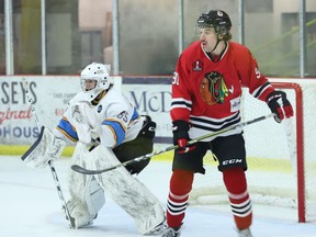 Renfrew goalie Sebastian Resar and Brockville forward Colin Elliott keep an eye on the action in front of them during the first period of the Wolves-Braves game at the Brockville Memorial Centre on Friday, Nov. 11. Resar made 30 saves and was named first star in Renfrew's 3-0 victory. Elliott was named third star.
Tim Ruhnke/The Recorder and Times/Postmedia Network