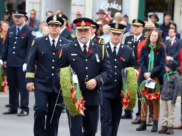 Brockville Deputy Fire Chief Chris Paul, left, Police Chief Mark Noonan and Fire Chief David Lazenby prepare to lay wreaths at the cenotaph. (RONALD ZAJAC/The Recorder and Times)
