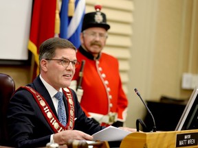 Brockville Mayor Matt Wren delivers his inaugural address on Tuesday evening while Gord McFarlane, of the Brockville Infantry Company re-enactors group, stands as part of the ceremonial guard. (RONALD ZAJAC/The Recorder and Times)