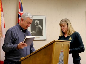 Brockville Coun. Mike Kalivas is sworn in as a member of the Brockville Police Services Board on Tuesday afternoon by board secretary Tracy Caskenette. Kalivas is the new council appointee, replacing Larry Journal, who did not stand in the recent municipal election. (RONALD ZAJAC/The Recorder and Times)