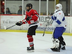 Brockville forward Jake Laville and Navan goalie Diego D'Alessandro during the Braves-Grads game at the Brockville Memorial Centre on Friday, Nov. 25, 2022.
Tim Ruhnke/Postmedia Network