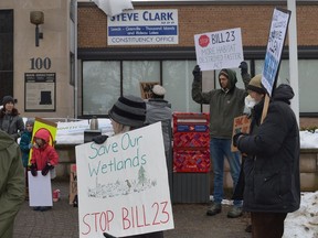 About 30 people gather in front of MPP Steve Clark's constituency office in Brockville early Friday afternoon to protest the provincial government's Bill 23 proposal. The pop-up rally was organized by Sustainable North Grenville and Sustainable Merrickville-Wolford.
Tim Ruhnke/Postmedia Network