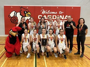 The Lambton-Kent Cardinals celebrate their victory in the SWOSSAA junior girls’ basketball A final at Lambton-Kent Composite School in Dresden, Ont., on Wednesday, Nov. 16, 2022. The Cardinals are, front row, left: Sam Lambrecht, Alivia Coles, Lexi Taylor, Addy Gawne and Victoria Sanchez. Back Row: coach Beth Debicki, Sophia Metcalfe, Charlotte Wallace, Julia Pegg, Marissa McGee, coach Tom Moynihan and coach Sara Weed. (Contributed Photo)