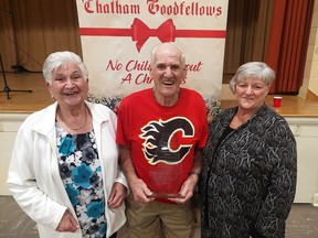 The Morlog family has received the Lifetime Achievement Award from the Chatham Goodfellows.  Siblings, from left, Cora VanBrunschot, Jim Morlog and Gert McFadden, are seen here with the award, presented Thursday night during Goodfellows annual dinner meeting.  PHOTOEllwood Shreve/Chatham Daily News.