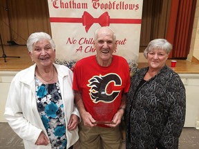 The Morlog family has received the Lifetime Achievement Award from the Chatham Goodfellows. Siblings, from left, Cora VanBrunschot, Jim Morlog and Gert McFadden, are seen here with the award, presented Thursday night during Goodfellows annual dinner meeting. PHOTOEllwood Shreve/Chatham Daily News.