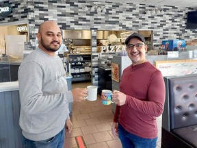 Koullies Stylianou, right, who has been making pizzas in Chatham for 42-and-a-half years, retired Monday and has sold his popular restaurant Andy's Place to Harshana Fernando, who is taking over on Wednesday, and says everything will remain the way it is today. (Ellwood Shreve/Chatham Daily News)