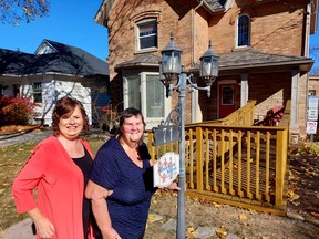 Mental Health Network of Chatham-Kent executive director Kelly Gottschling, left, and member Cathy Harback are seen here in front of 71 Raleigh St. in Chatham, where the agency provides services and support to 300 people age 16 and up who have mental health issues. (Ellwood Shreve/Chatham Daily News)