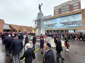 The Remembrance Day Parade processes around the cenotaph in downtown Chatham at the conclusion of the annual Remembrance Day ceremony on Friday.  (Ellwood Shreve/Chatham Daily News)