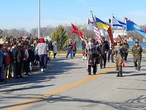 A color guard marches during a Remembrance Day ceremony held on Walpole Island First Nation Thursday.  (Ellwood Shreve/Chatham Daily News)