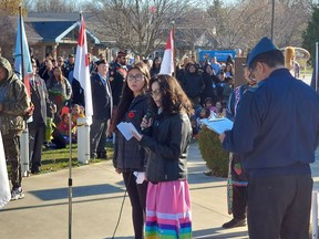 Wallaceburg District Secondary School students, Makaiyah Stonefish, left, and Sage Kicknosway, who members of the Future Elders program, took part in a Remembrance Day ceremony held on Walpole Island First Nation Thursday. (Ellwood Shreve/Chatham Daily News)