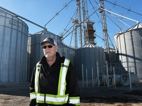 Wallaceburg farmer Dennis DeBot is shown near the grain storage bins and dryer system on his farm. He has been named the agriculture innovator of the year by the Chatham-Kent Chamber of Commerce. (Tom Morrison/Postmedia)