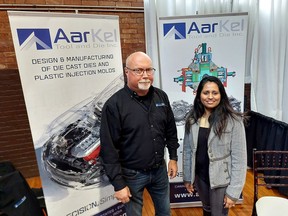 Dennis Alexander, left, operations manager at AarKel Tool and Die Inc. and Julie John, human resources manager, collective several resumes at the Chatham-Kent Community Job Fair Tuesday, held at The Chatham Armory.  PHOTO Ellwood Shreve