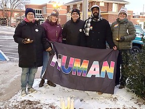 CK Gay Pride Association board members Amy Vickery, Nancy Kay, Dave Butler, Nathan Dawthorne and Daphne Houston hold a flag outside the Chatham-Kent Civic Centre in recognition of Transgender Day of Remembrance last Sunday. (Handout/Postmedia Network)