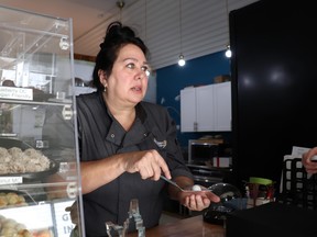 Chef Tammy Maki, owner of Raven Rising Global Indigenous Chocolates, serves treats at her downtown storefront on Cedar Street. PHOTO BY MIA JENSEN/The Sudbury Star