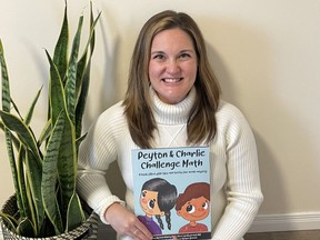 Dr. Erin Maloney, with a copy of her new book that helps in coping with math anxiety. Handout/Cornwall Standard-Freeholder/Postmedia Network
