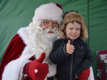 Santa said Lachlan Thompson is on the nice list this year, outside of the CP Holiday Train on Monday November 28, 2022 in Finch, Ont. Shawna O'Neill/Cornwall Standard-Freeholder/Postmedia Network