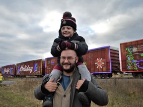Alexander Glaslord (above) laughing with excitement at the CP Holiday Train stop, sitting atop Sebastian Lord's shoulders on Monday November 28, 2022 in Finch, Ont. Shawna O'Neill/Cornwall Standard-Freeholder/Postmedia Network