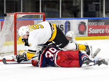 Cornwall Colts Chaka-Benjamin Ntumba-Muntu lies under Smiths Falls Bears Justin Chaput as Colts goaltender Dax Easter watches the puck go left, on Thursday November 3, 2022 in Cornwall, Ont. Cornwall lost 4-1. Robert Lefebvre/Special to the Cornwall Standard-Freeholder/Postmedia Network
