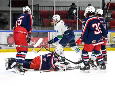 Cornwall Colts players, including a prone goaltender Dax Easter, in the foreground as Hawkesbury Hawks Jakson Kirk skates past after scoring on Thursday November 10, 2022 in Cornwall, Ont. Cornwall lost 7-6. Robert Lefebvre/Special to the Cornwall Standard-Freeholder/Postmedia Network