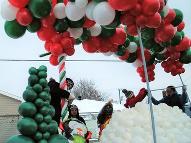 Participants complete the finishing touches for the Balloon Babes entry before the start of the Santa Claus Parade on Saturday November 19, 2022 in Cornwall, Ont. Greg Peerenboom/Special to the Cornwall Standard-Freeholder/Postmedia Network