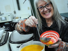 Agapè Centre executive director Lisa Duprau pours herself a bowl of the winning entry in the Empty Bowls soup contest at the Agora Catholic Centre on Sunday November 20, 2022 in Cornwall, Ont. Greg Peerenboom/Special to the Cornwall Standard-Freeholder/Postmedia Network