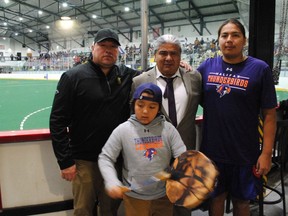 Bottom, drummer Navarro Phillips lent to the atmosphere of the National Lacrosse League pre-season game between Halifax Thunderbirds and Las Vegas Desert Dogs enjoyed by, top from left, Strong Roots Charitable Foundation president Carey Terrance, Thunderbirds owner Curt Styres and his son, Thunderbirds' player Wake:Riat Bow Hunter at the A'nowara'ko:wa Arena, on Sunday November 13, 2022 in Akwesasne. Greg Peerenboom/Special to the Cornwall Standard-Freeholder/Postmedia Network