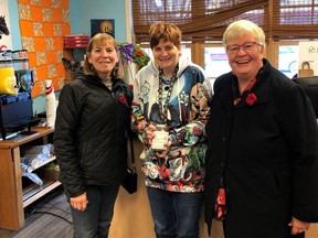 Sheena Small, from Sheena's Sweets accepting a Hero's Donation Jar for her store standing with Marion Bentz (L) and Glenda Cutforth (R) from High River United Way Partnership. Hero's Week runs from November 16th to November 30th. Photo by Fraser Small