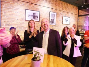 Kingston mayoral candidate Bryan Paterson and some of his supporters react to early results of the municipal election that showed he had a commanding lead in the race for mayor Monday.