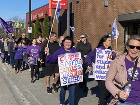 Hundreds of Canadian Union of Public Employees education workers and supporters picket along Princess Street and past Kingston and the Islands MPP Ted Hsu's constituency office on Friday morning, after the government passed legislation that imposed a contract and rendered strike action illegal.