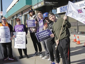 Local educational support workers, and their supporters of all ages, continue to protest outside and around the block of Kingston and the Islands MPP Ted Hsu's constituency office on Princess Street in Kingston on Monday.