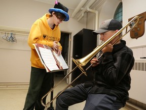 Spencer Green, a cooperative education teacher with the Harmony Lounge and Music Club program, teaches Matthew Lalonde on trombone at St. Mary Magdalene Anglican Church in Napanee on Nov. 8.