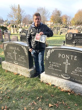 Joe Ponte stands between monuments meant to mark the graves of his maternal grandparents, left, and his parents.  This last stone, however, was installed in the wrong plot in 2017, forcing the Ponte family to bury their recently deceased mother in an unmarked grave next to her sister and brother-in-law.