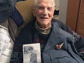 Stu Crawford, then 98, with the same RCAF dress uniform that he's wearing in the 1944 self-portrait. Crawford died on Nov. 7, 2022, at 100.
