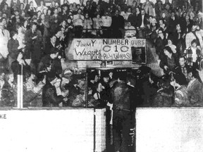 The back of assistant trainer Len Coyle signals the last exit of the season for the Kingston Canadians following their 9-7 loss to the Toronto Marlboros on Monday night, April 7, 1975, at the Memorial Center before a crowd of 4,335. The first-place Marlboros were extended to the full eight games before winning the eight-point OHA Major Junior A Hockey League quarter-final.