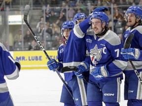 Sudbury Wolves captain Jacob Holmes celebrates with his teammates after putting them on the scoreboard against the Kingston Frontenacs during the first period of Ontario Hockey League action at the Leon's Centre in Kingston, Ont. on Friday, Nov. 25, 2022.