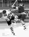 Kingston Frontenacs David Ling knocks down a Niagara Falls Thunder player in the 1994-95 Ontario Hockey League season.