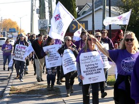 Hundreds of Kingston area school workers, members of the Canadian Union of Public Employees (CUPE), march in Kingston around M.P.P Ted Hsu's office on Princess Street on Friday November 4, 2022. The route went from Princess Street, Drayton Avenue and Concession Street.