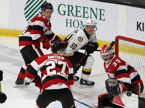 Kingston Frontenacs forward Linus Hemstrom watches his shot go past Ottawa 67's goaltender Max Donoso as 67's Matthew Mayich, left, and Jack Matier look on during Ontario Hockey League action at the Leon's Centre in Kingston on Wednesday.