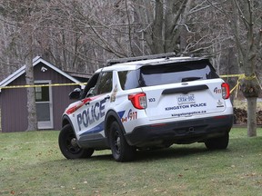 A Kingston Police vehicle is parked outside a home on McKendry Road, just south of Unity Road on Tuesday morning after police started a homicide investigation Monday.