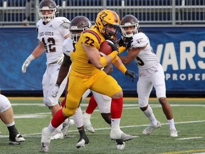 Running back Anthony Soles scampers into the end zone for the Queen's Gaels in an Ontario University Athletics football semifinal against the Ottawa Gee-Gees on Saturday at Richardson Stadium. Queen's won the game, 35-13.
