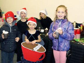 Jase Ollenberg, Yuri, Rebecca and Adrianna Soroka and Leena Ollenberg offered goodies from Mayerthorpe’s Gourmet Hot Chocolate at the 45th Christmas Market.