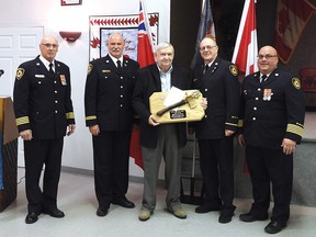 Photo by Jacqueline Rivet
Ashton received a golden axe. On hand were Deputy Chief Henry Gerard, Terrance Smith, Wayne Ashton (centre), Andre Therrien and Mike Pichor.