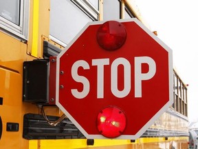 A school bus stop sign
