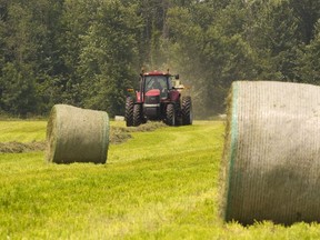 A farmer bales hay in this file photo.