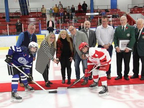 The 38th Annual Terry O'Neill Pembroke Regional Silver Stick Tournament got underway on Nov. 11 with the children of the tournament's namesake conducting the ceremonial faceoff. Taking the faceoff were Wyatt Manion of the Perth Lanark Wings and Mason Moreau of the Pembroke Kings. In back are, from left, Shaun O'Neill, Shelley O'Neill-Prescott,  Wendy O'Neill, Daniel O'Neill, Pembroke Mayor Elect Ron Gervais, Pembroke Minor Hockey Association President Jason Laronde, Pembroke Regional Silver Stick director Norbert Chaput and International Silver Stick director and past tournament director Charles Chappell. First weekend Silver Stick coverage Page 22. Anthony Dixon